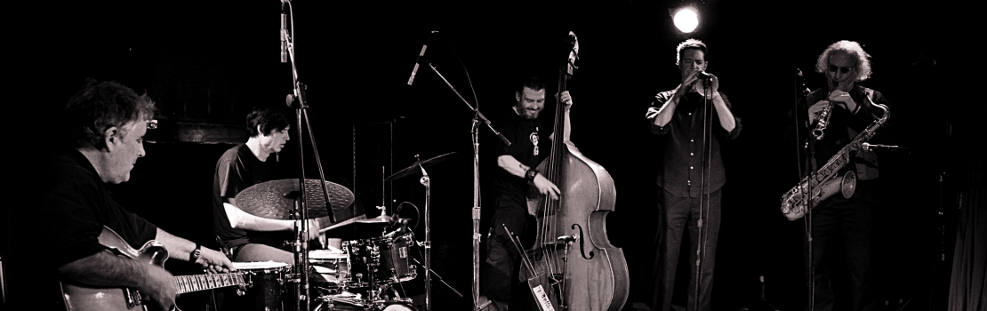 Fred Frith, Ches Smith, Devin Hoff, Darren Johnston and Larry Ochs by Myles Boisen